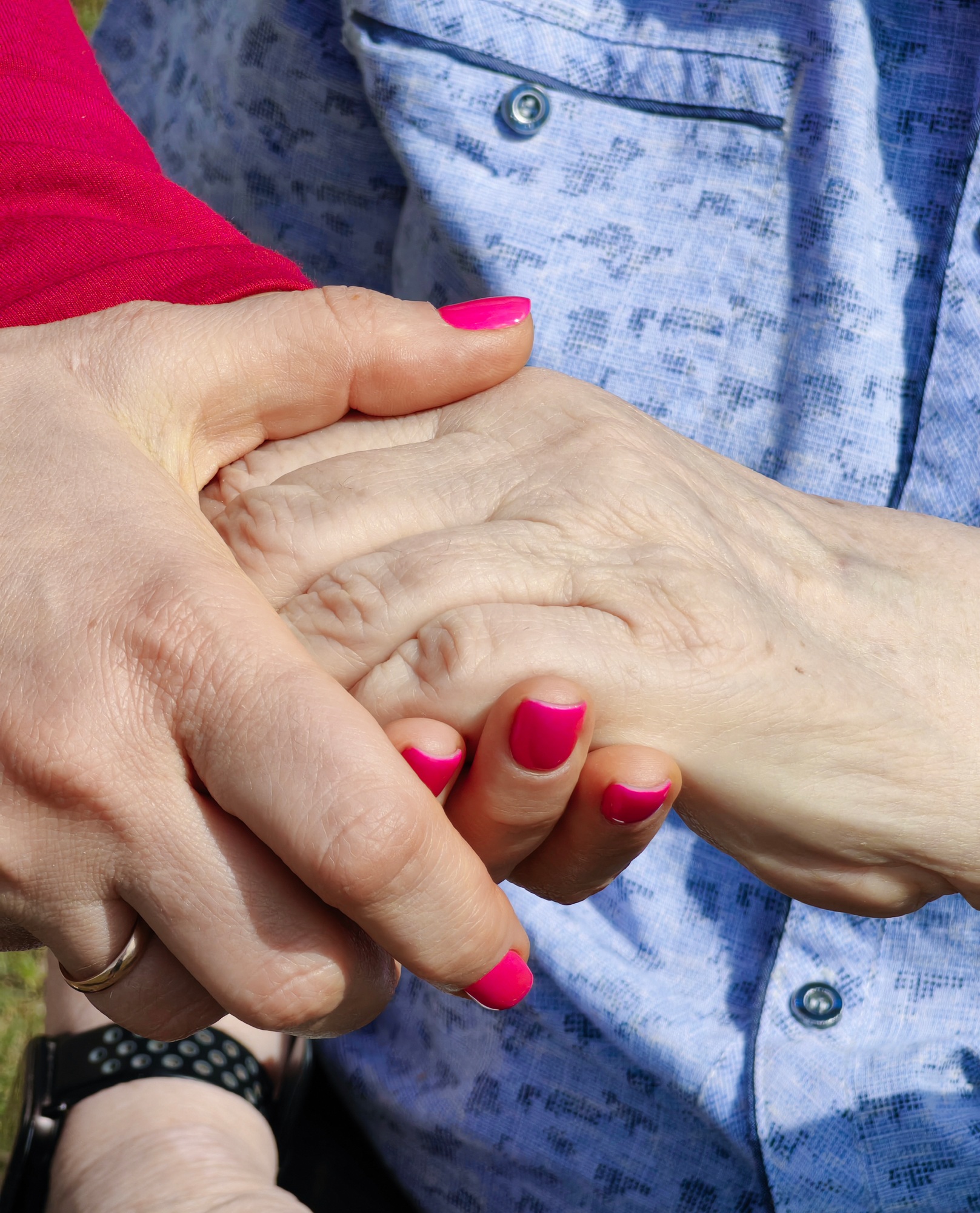 A hand supports an old man, support in old age
